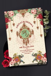 A Royal Rajputana Design Wedding Invitation Card With Red Roses And Majestic Elephants