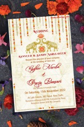 A Wedding Invitation Card Full of Golden Grandeur With Garlands Of Marigold Flowers, Majestic Elephants And A Pink Lotus