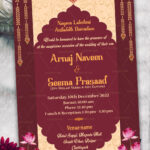 Traditional Cream And Maroon Theme Wedding Invitation Card With Hanging Garlands, Pink Lotus And Gold Accents